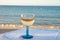Summer time in Provence, drinking of cold gris rose wine on sandy beach and blue sea near Toulon, Var department, France