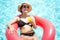 Summer time and Vacations. Women lifestyle with on donut Rubber ring drinking orange juice