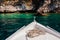 Summer time view from yacht gangway on the rocky cliff, Azure clear waterr near cliff. Boat trip.island Greece.the stern