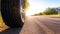 summer tires on the asphalt road in the sun