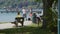 summer tourists and passers by at lakeside at Attersee in Upper Austria