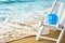 Summer and travel concept piggy bank on beach chair at beach