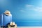 Summer travel essentials on blue background suitcase with hat, sunglasses, passport, and slippers