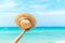 Summer Travel. Happy and Relax woman hand holding big hat on white sand beach,