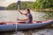 Summer Travel Kayaking. Man Paddling Transparent Canoe Kayak, Enjoying Recreational Sporting Activity. Male Canoeing