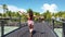 Summer travel vacation woman cheering running dancing joyful excited to be at Luxury resort in tropical paradise. People