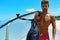 Summer Travel Water Sport. Man Holding Canoe Kayak On Beach