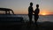 Summer travel of young couple in love to shore sea, romantic trip of lovers on seafront in sunset,