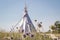 Summer vacation camping tent, indian wigwam hut, in dry wild nature prairie steppe