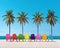 The summer vacation concept background has multicolored beach chrs and palms.