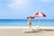 Summer vacation concept, miniature cute girl in pink swim suite on the beach