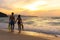 Summer Vacation. Couple walking holding hands on tropical on the beach sunset time in holiday after snorkel swim. Honeymoon holid