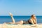 Summer vacation Girl in bikini sunbathing on beach