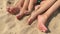 Summer vacation, happy feet on the beach. Feet closeup of relaxing on beach in sunny summer day.