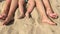 Summer vacation, happy feet on the beach. Feet closeup of relaxing on beach in sunny summer day.