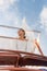 Summer vacation,happy women relaxing on the roof of yacht at sunset. Andaman sea Thailand