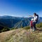 Summer vacation in mountain. Father and young son standing in a