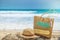 Summer vacation at Phuket beach, Wooden bag with sunglass, on summer beach, Equipped with wooden hat on timber near the sea,