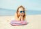 Summer vacation, relaxation, travel concept - portrait child lying resting on beach