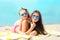 Summer vacation, relaxation, travel - mother and child lying resting on beach