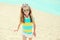 Summer vacation, travel concept - little girl child on beach wearing sunglasses