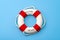 Summer vacation, welcome aboard and safety equipment for swimming concept with white and red life buoy or lifesaver isolated on