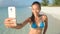 Summer vacation woman beach babe taking selfie of her beach body during travel