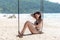 Summer Vacations. Lifestyle women swimsuit bikini relaxing and enjoying swing on the sand beach, fashion summer on the tropical is