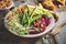 Summer Vegetarian Salad with Beetroots Hummus, Green Asparagus, Carrots, Cucumber and Germinated Seeds.