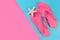 Summer Vibes: Femininity Girl Pink Sandal Flip Flops and Starfish on Abstract Pastel Background