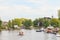 Summer view of the Amstel river with houses and boats in the small Dutch village of Ouderkerk aan de Amstel