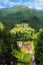 Summer view of Carpathian Mountains landscapevillage Vorohta Ukraine. Green forests, hills, grassy meadows and blue sky