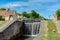 Summer view of a flooded sea lock with flowing water