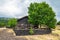 Summer view of lava stone Carpinteri refuge on Mount Etna, Sicily