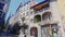 Summer view of typical cobbled streets in historic center of Clermont-Ferrand overlooking medieval Terrail fountain on