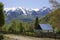 Summer view valley and rural small house. Alpine landscape.