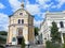 Summer views of ancient religious and modern architectural and sculptural art of Kyiv next to destroyed military equipment.