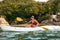 Summer Water Sport. Woman Traveling In Kayak Near Green Island