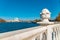 Summer waterfront park district white marble fence architecture object foreground and river waters with modern building bright