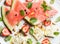 Summer watermelon, strawberry and feta cheese salad with pistachios