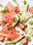 Summer watermelon, strawberry and feta cheese salad with pistachios