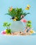 Summer weekend party concept. Flamingo, toucan, palms, tropical flowers and beach accessories on blue background