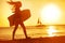 Summer woman body surfer beach fun at sunset