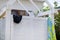 Summer, wooden roofed shower in the courtyard