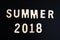 summer word wood text and 2018 happy new year on Blackboard and