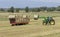 Summer works in the fields of the Tuscan countryside in the province of Pisa, Tuscany, Italy