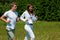 Summer - Young couple running in meadow