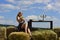 Summer young girl countryside. Woman on the hay.