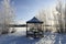 Summerhouse on the shore of a frozen lake