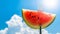 Summertime Bliss: Captivating Close-up of Juicy Red Watermelon on Fork Under Sunlit Blue Sky